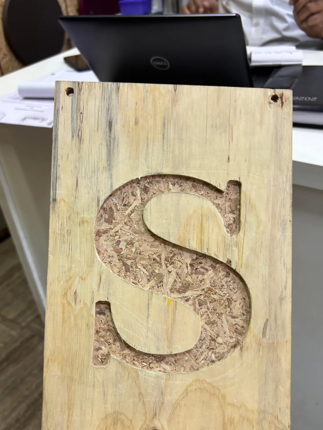 A Hybrid OSB sample cut through the face, exposing the strand core