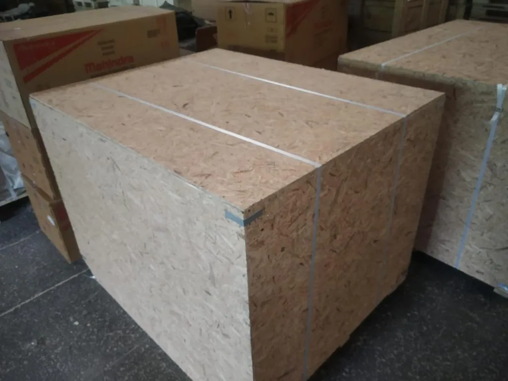 A closed export case built from oriented strand board, strapped and ready