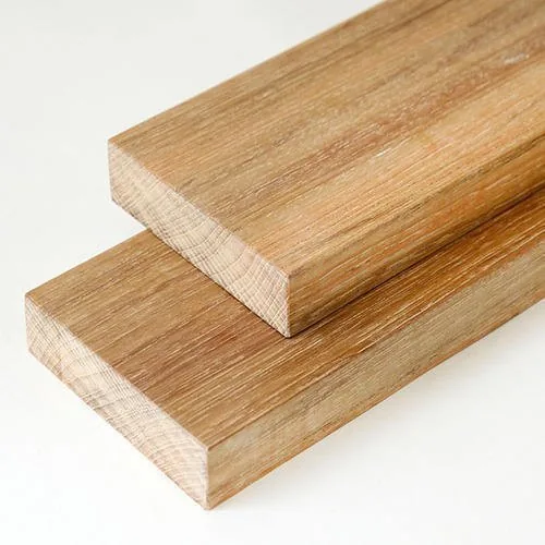Seasoned teak boards stacked in the yard